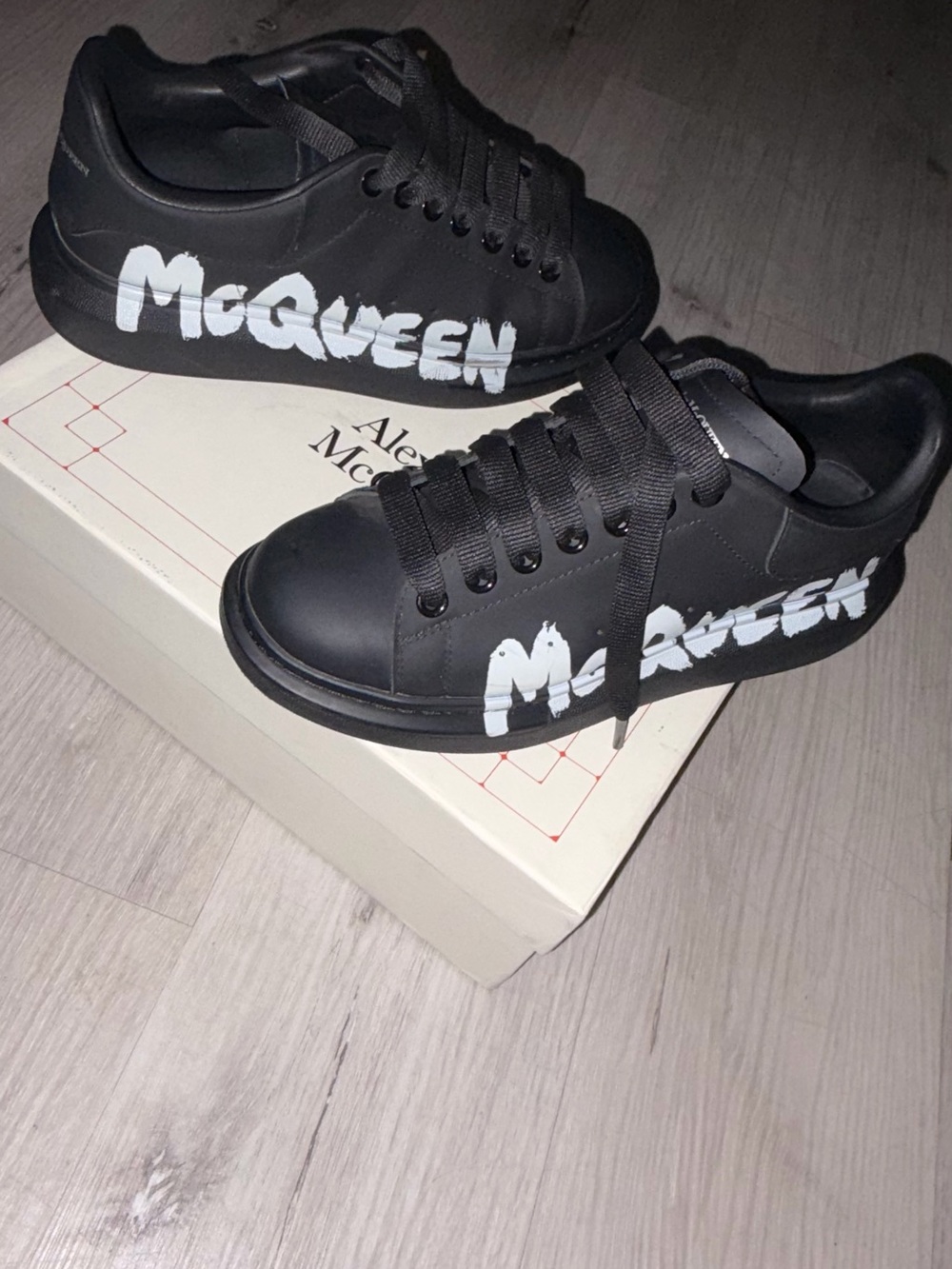 Alexander McQueen Black Leather Sneakers with White Graffiti Logo